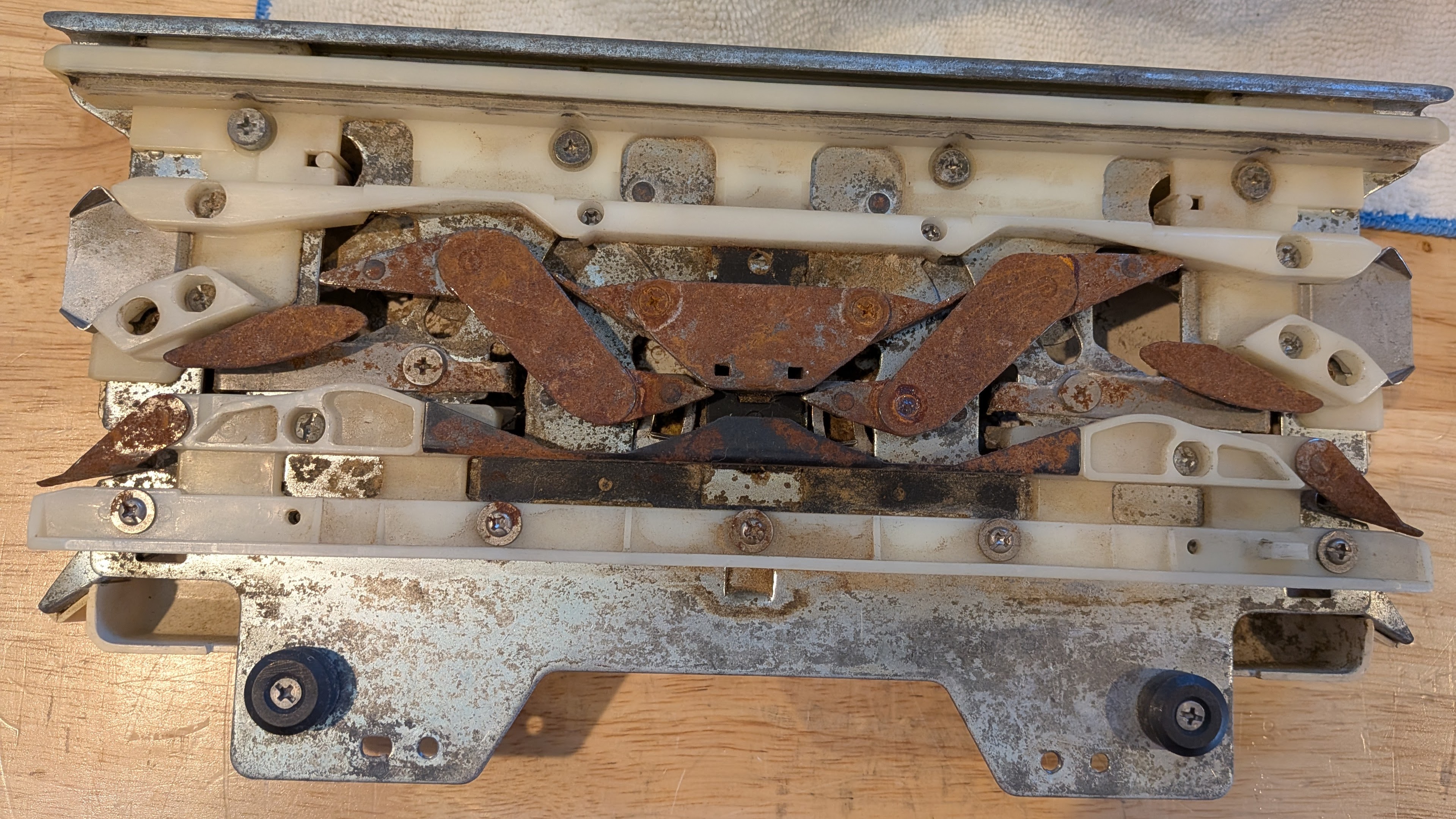 A badly rusted knitting machine carriage — this is a walk-away
