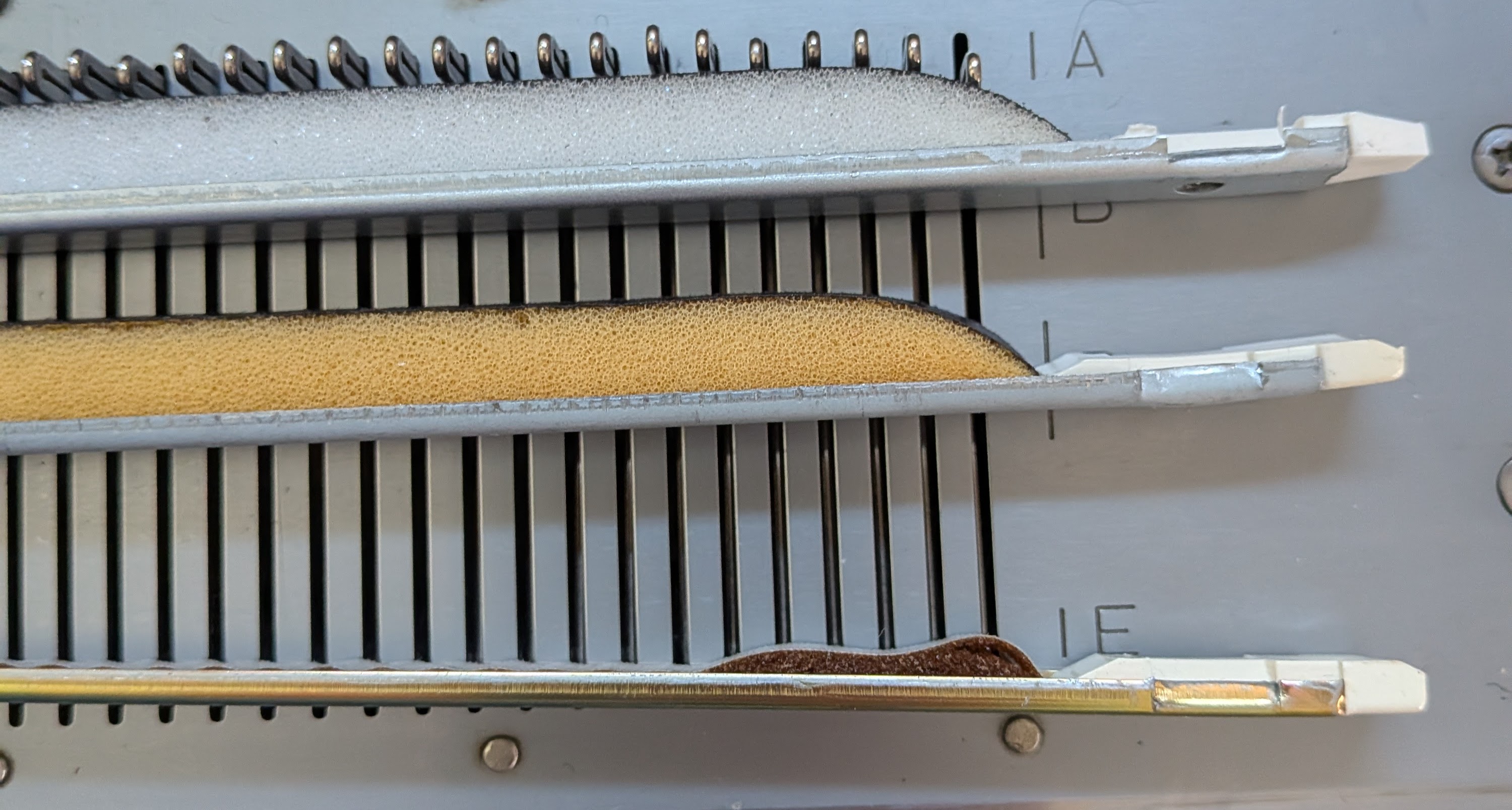 Three sponge bars showing different levels of wear